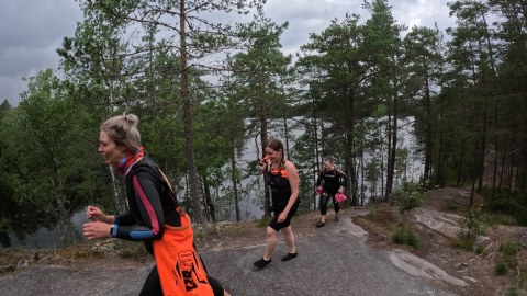 Women are hiking in the rocks