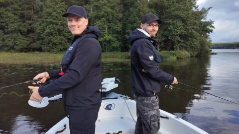 Two young men fishing in Lake Hiidenvesi