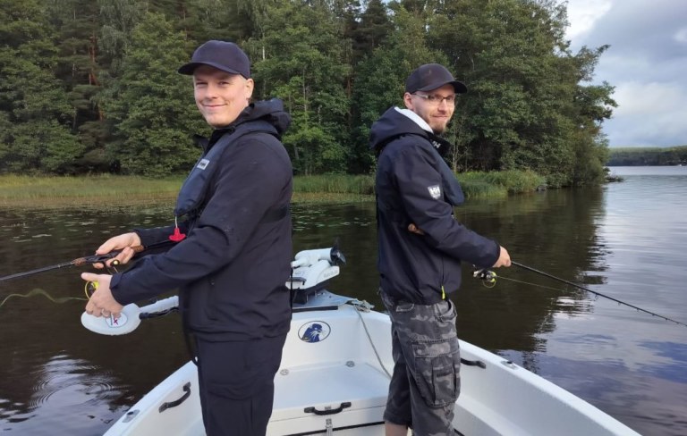 Two young men fishing in Lake Hiidenvesi