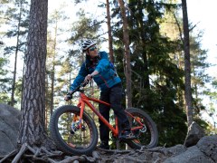 A man riding a fatbike in the forest